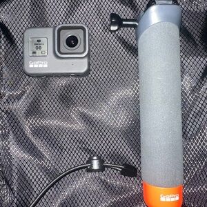 GoPro with Black and Orange Handle